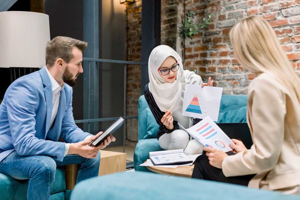 a girl is explaining the details of islamic estate planning with her clients