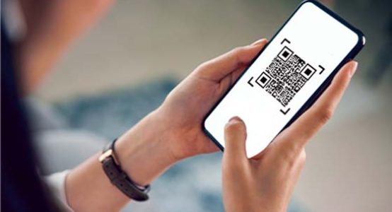 woman using smartphone for qr code payment mobile